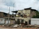 The destroyed home of well-known Ecuadorean DXer Lilian de Ayala, HC4L. She barely escaped serious injury or death when her house collapsed. [Courtesy of Rick Dorsch, NE8Z/HC1MD]